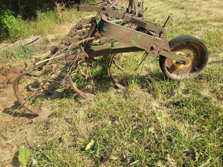 green-farm-cultivator-implement-with-tines-and-gauge-wheels-image-3