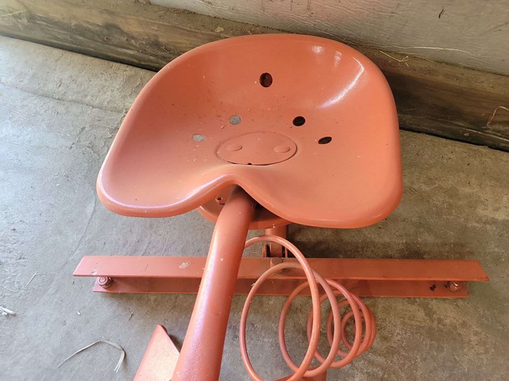 orange-painted-cast-metal-tractor-seat-with-spring-suspension-mount-image-3