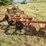 orange-three-bottom-tractor-plow-with-steel-frame-and-moldboards-image-2