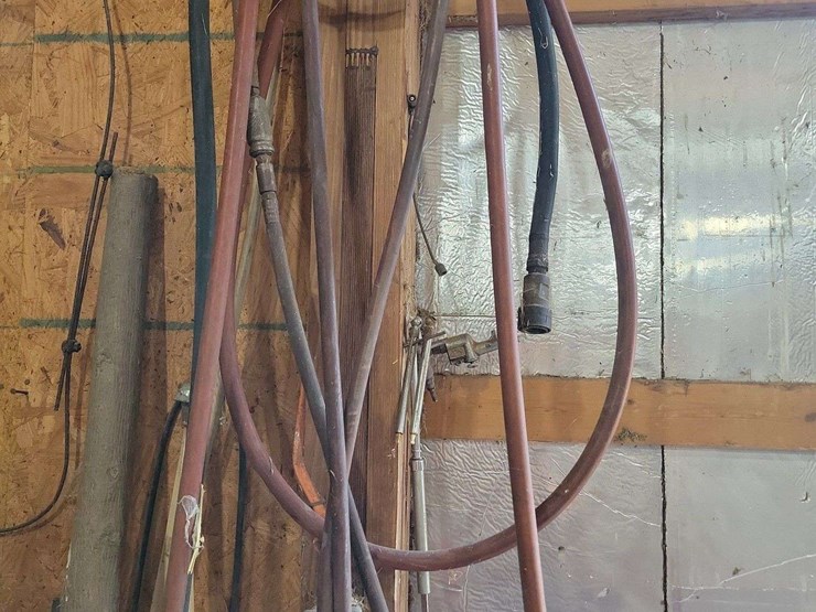 assorted-long-handled-tools-and-air-hoses-image-3