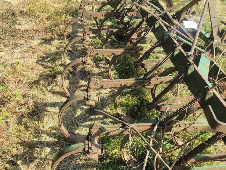 green-farm-cultivator-implement-with-tines-and-gauge-wheels-image-4