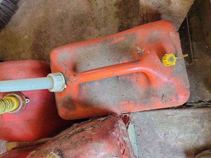 lot-of-red-fuel-cans-and-storage-box-image-2