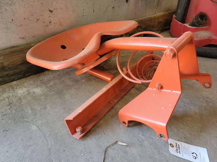 orange-painted-cast-metal-tractor-seat-with-spring-suspension-mount-image-1