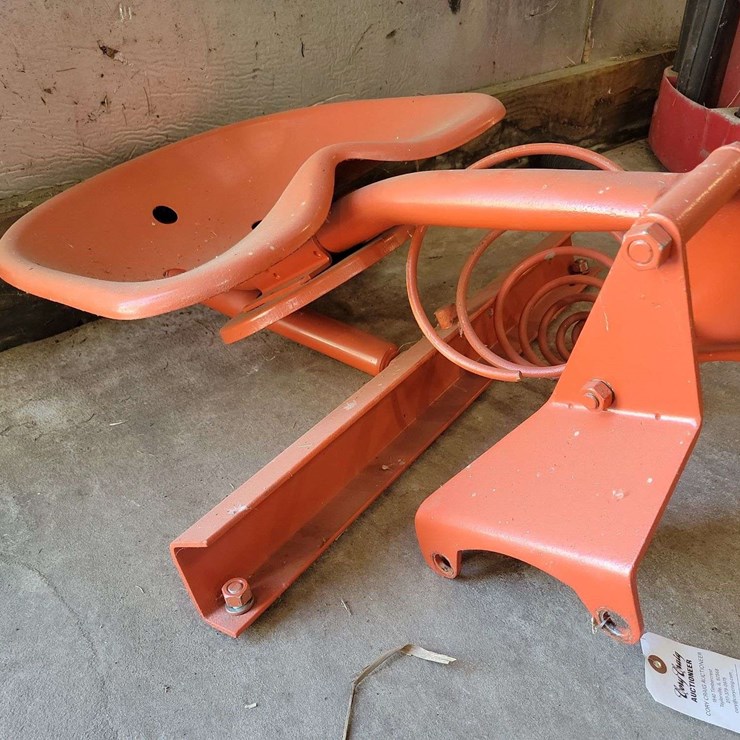 Orange Painted Cast Metal Tractor Seat with Spring Suspension Mount