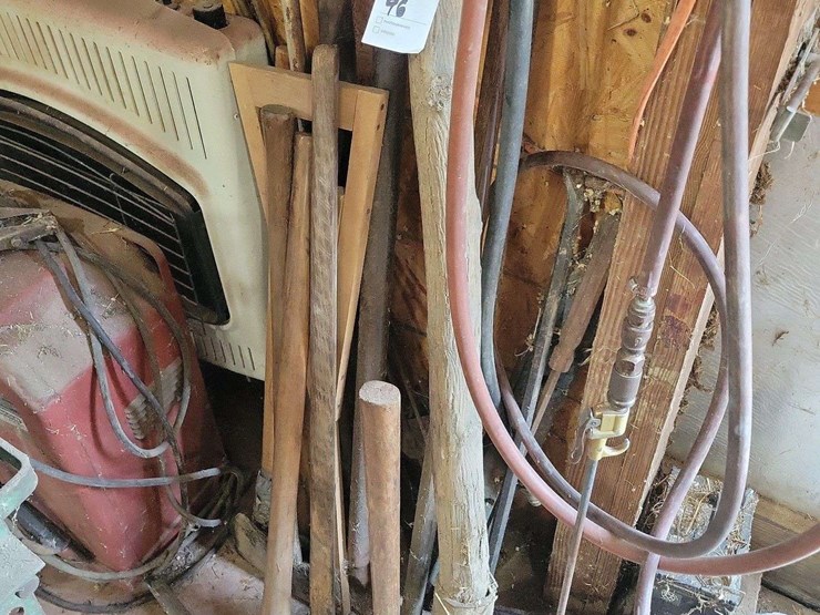 assorted-long-handled-tools-and-air-hoses-image-1