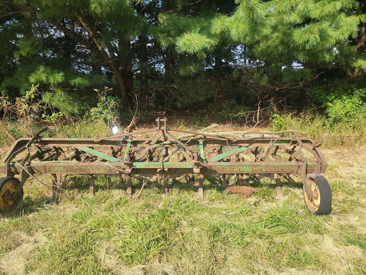 green-farm-cultivator-implement-with-tines-and-gauge-wheels-image-2