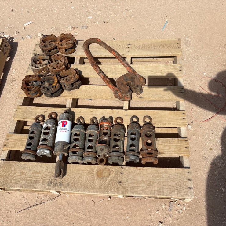 Pallet w/ (7) rod tong heads, (8) rod transfers, & (1) plate type rod elevator