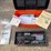 #88-•-orange-toolbox-with-gun-manuals,-and-tools-image-1