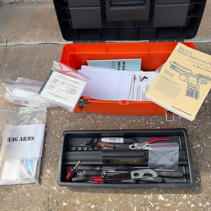 #88 • Orange toolbox with gun manuals, and tools