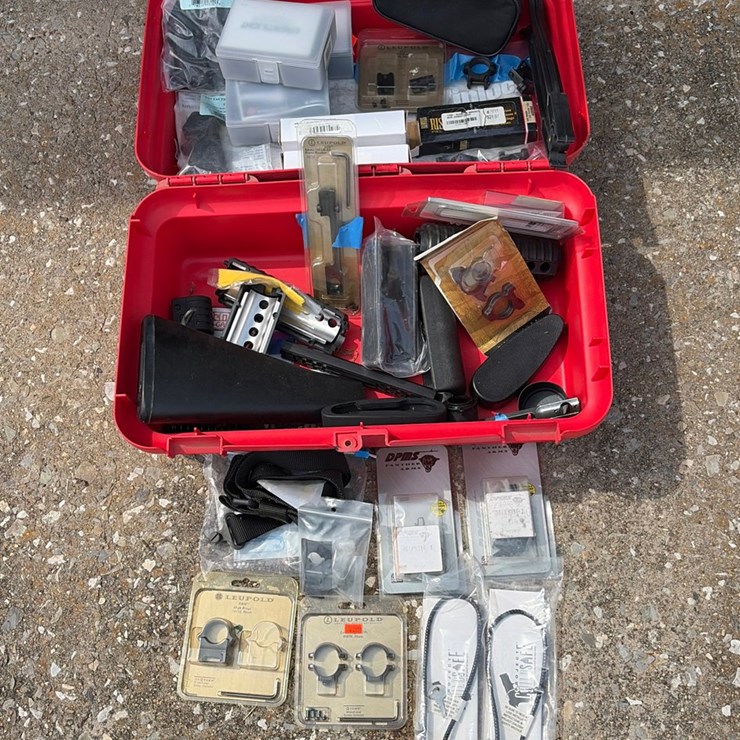 #87 • Red tool box with gun accessories, gun locks, scope, mounts, stock, grips I’m related