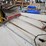 #9228-•-rack-of-assorted-brooms-image-9