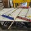 #9228-•-rack-of-assorted-brooms-image-2